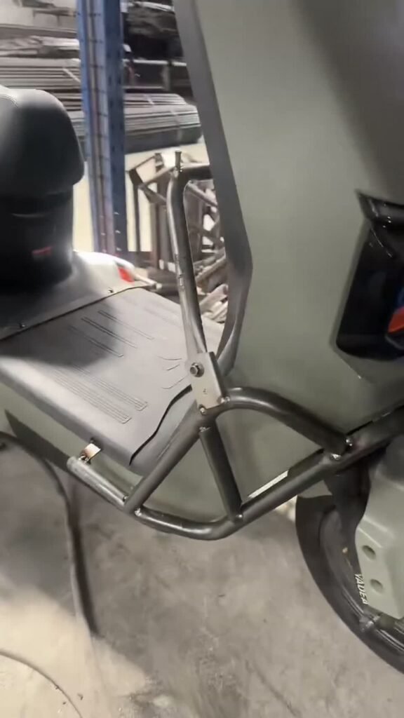 Tubular motorcycle part positioned on a vehicle for fitment review